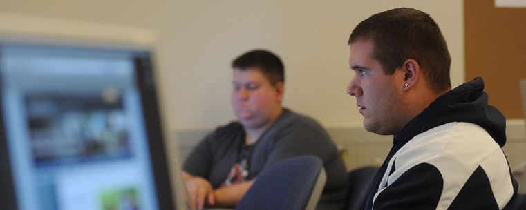 Students in the School of Journalism and Mass Communication work on a project in Franklin Hall.