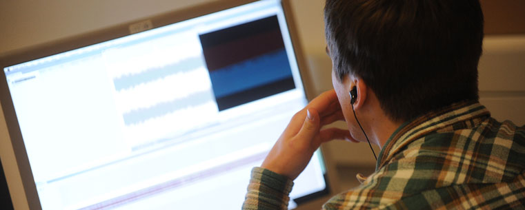 A student edits a sound file on a computer lab in Franklin Hall.