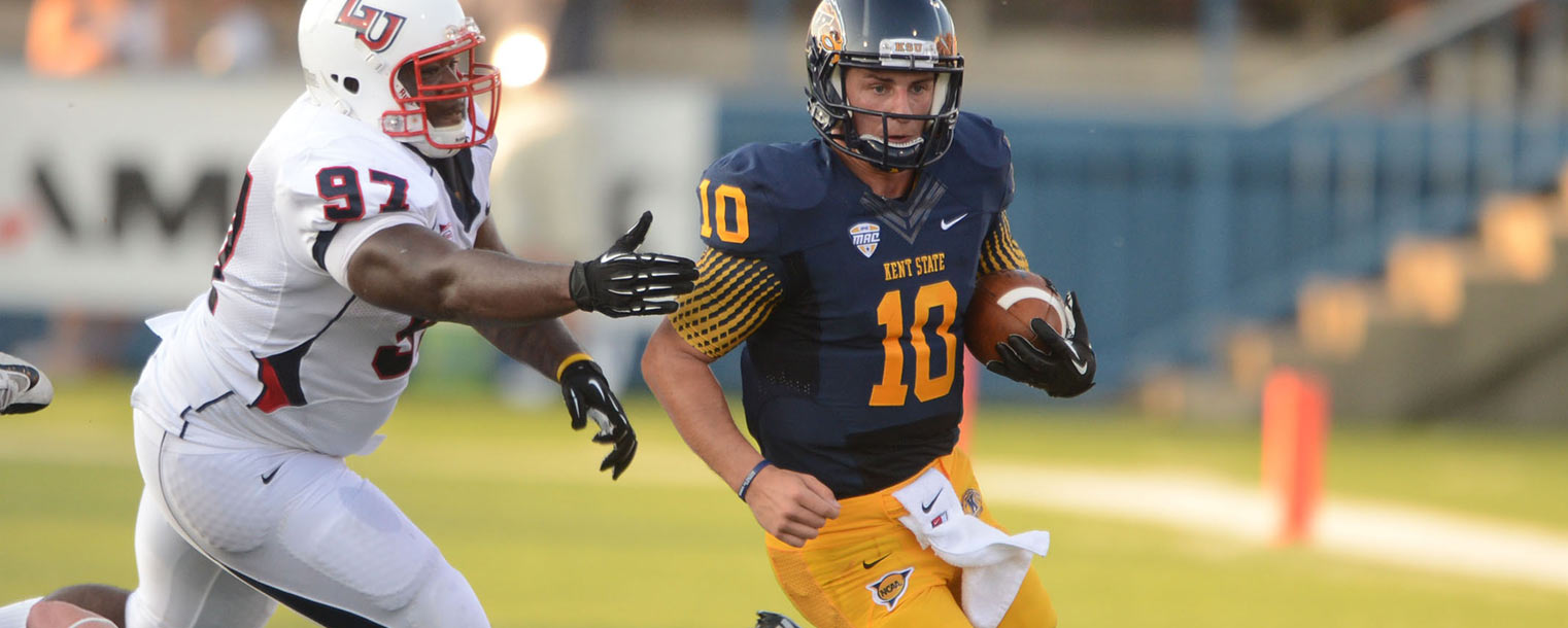 Kent State quarterback Colin Reardon gains some yards during the second quarter.