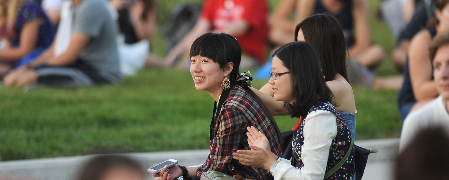 Students listen to a band during the Black Squirrel Fest held on the Student Green.