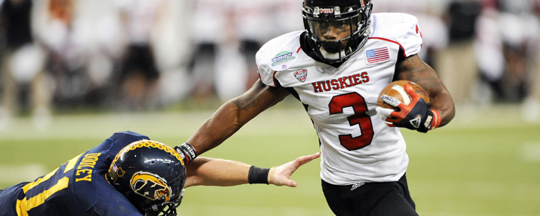 Jake Dooley makes a diving tackle of Northern Illinois running back Tommylee Lewis, during the second half of the MAC Championship game, in Detroit.