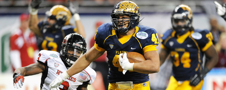 Zack Hitchens returns a Northern Illinois fumble 22 yards for a touchdown during the fourth quarter of the MAC Championship game, in Detroit.