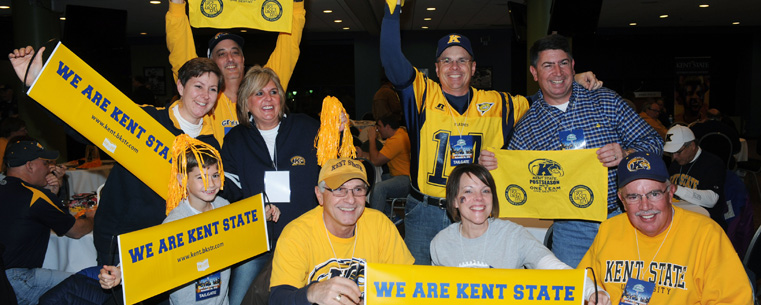 Kent State fans celebrate at an alumni pre-game dinner at Ford Field, in Detroit, prior to the start of the MAC Championship game.