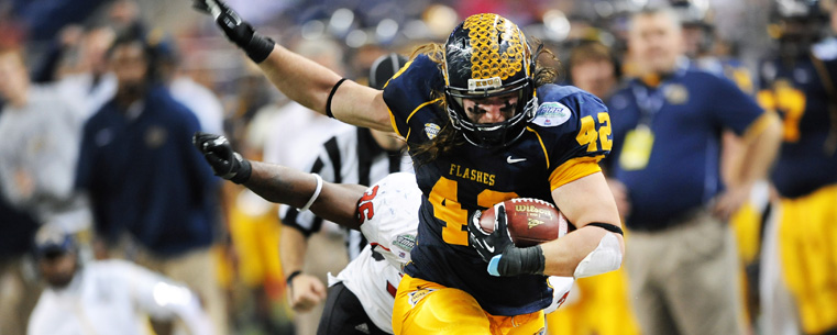 Kent State's Tim Erjavec makes a critical first down during overtime against Northern Illinois, in the MAC Championship game, in Detroit.