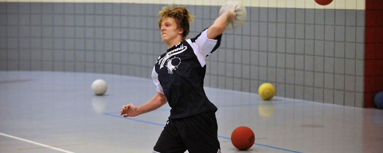 Kent State Dodgeball Club member Mitchell Malleo fires a ball at an opponent during a match in the Student Recreation and Wellness Center.