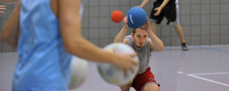 Billy Cameron, a member of the Kent State Dodgeball Club, ducks for cover during a dodgeball match in the Student Recreation and Wellness Center.