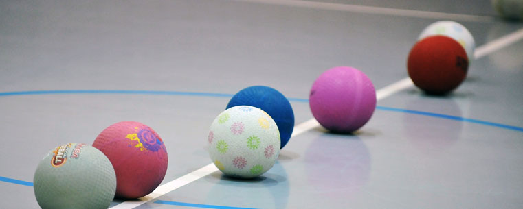 Dodgeballs line the center of the court prior to the start of a Kent State Dodgeball Club match.