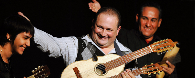 <p>Edwin Colon Zayas acknowledges a Kent State student who took part in his performance during the 2009 Kent State Folk Festival.</p>