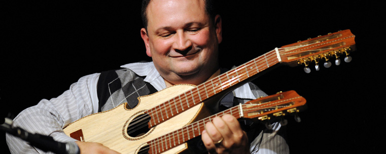 <p>Edwin Colon Zayas performs with a cuatro, a stringed instrument noted for its use in peasant music from the mountains of Puerto Rico.</p>