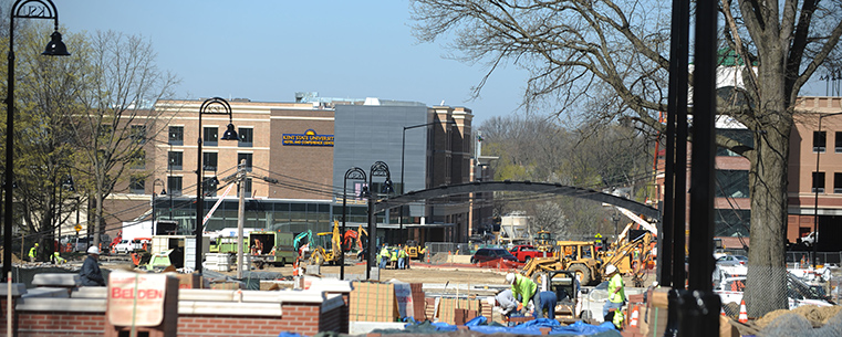 Workers are busy extending the Kent State University Esplanade from campus into downtown Kent. The University Esplanade extension strengthens the ties between the university and the city by providing a physical link, providing students with a safe pathway to visit, enjoy and patronize downtown Kent and its businesses, as well as connecting residents and visitors to the Kent Campus.