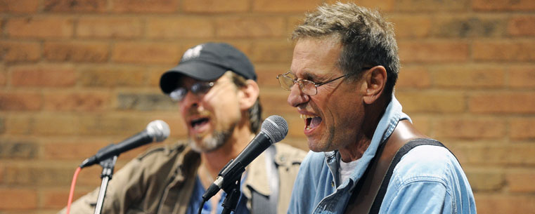 Musicians perform in Acorn Alley in downtown Kent during the Friday afternoon 'Round Town performances of the Kent State Folk Festival.