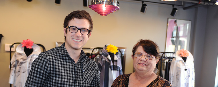 Scott Bunner, a junior Kent State University student majoring in merchandising and manager of the university's new Fashion School Store, is pictured with Nancy Stanforth, Ph.D., Kent State associate professor and faculty advisor of the store.