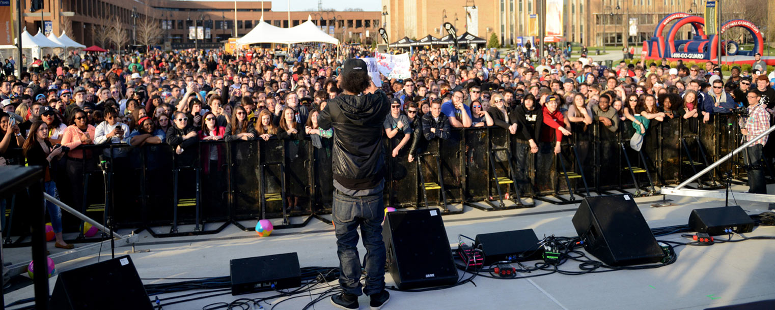 Kent State students take advantage of the warmer weather to celebrate with Ab-Soul during the 20th anniversary of FlashFest on the Student Green.