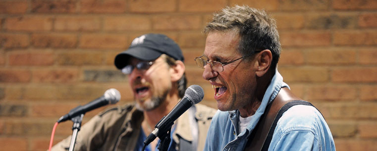 Local musicians perform in Acorn Alley in downtown Kent during the 'Round Town portion of the 2011 Kent State Folk Festival.