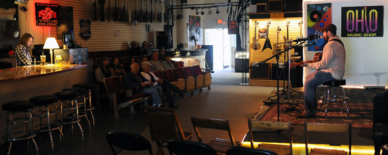 A local musician performs in the Ohio Music Shop in downtown Kent during the 'Round Town portion of the 2011 Kent State Folk Festival.