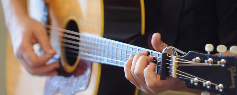 A guitarist performs in downtown Kent during the 2011 Kent State Folk Festival.