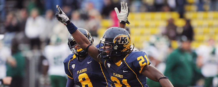 Kent State defensive back Sidney Saulter celebrates his interception in the end zone to end an Eastern Michigan threat in the fourth quarter at Dix Stadium. Teammate Calvin Tiggle joins the celebration.