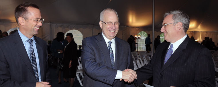 <p>Kent State University President Lester A. Lefton (center), Kent State Vice President for Institutional Advancement Eugene Finn (left) and Randy Ruttenberg (right), principal of Fairmount Properties, congratulate one another at the groundbreaking ceremony for the Kent State University Hotel and Conference Center.</p>