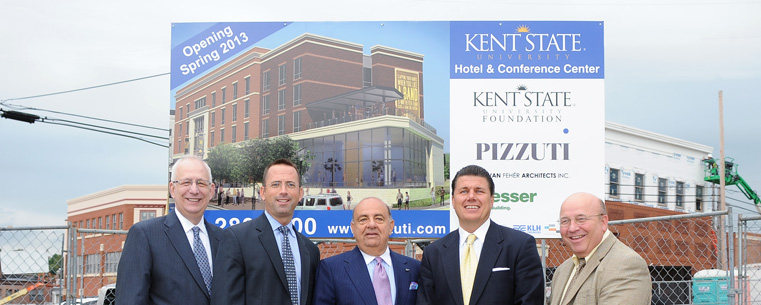 <p>(left to right) Kent State President Lester A. Lefton; Kent State Vice President for Institutional Advancement Eugene Finn; Chairman and CEO of the Pizzuti Companies and Kent State alumnus Ron Pizzuti; Kent State Foundation Board Investments Chairman and Kent State alumnus Gary Brahler; and Kent State Vice President for Finance and Administration Gregg Floyd stand at the site of the future Kent State Hotel and Conference Center in downtown Kent.<br />
</p>