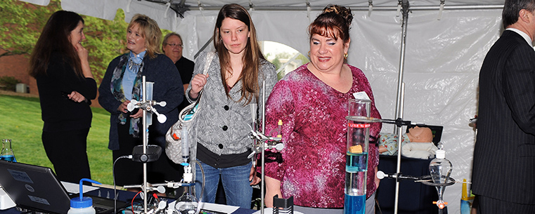 Guests attending the Sciences Building groundbreaking ceremony at Kent State University at Stark view “Sciences of Display” demonstrations prior to the event. The new building will be located adjacent to the existing Main Hall East Wing and connected by a bridge link at the second floor level.