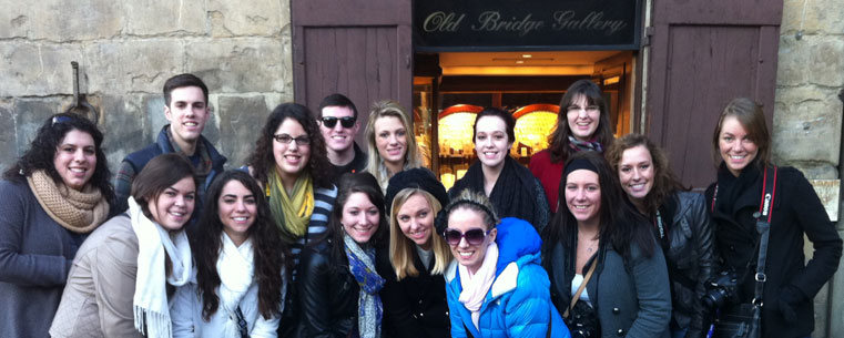 A group of Kent State University students studying abroad in Florence, Italy, pose for a photo. Thirty years later, Lydia Coutre (back row, third from left), a junior newspaper journalism major, is visiting the same sights her mother traveled to, retaking pictures of the same landmarks and blogging about her experience.