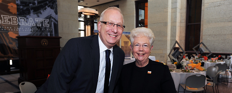 <p>Kent State University President Lester A. Lefton and Bowling Green State University President Carol A. Cartwright attend a luncheon in the Ohio Statehouse Atrium to mark the 100<sup>th</sup> anniversary of the Lowry Bill being signed into law. On May 19, 1910, the Lowry Bill created Kent State and BGSU.</p>