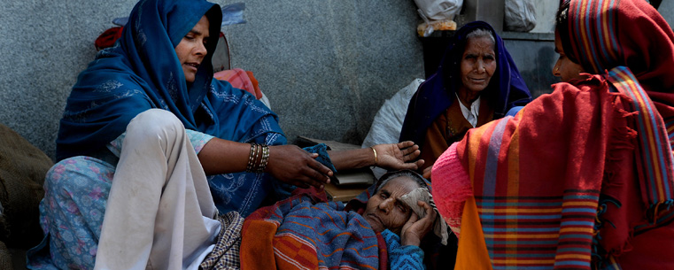 Many citizens within Delhi are unable to receive admittance into the hospitals in Delhi and are forced to live outside of AIIMS, All India Institute of Medical Science, the hospital located in South Delhi. This woman lives with her mother and family on the streets. (Photo by Kristin Bauer)