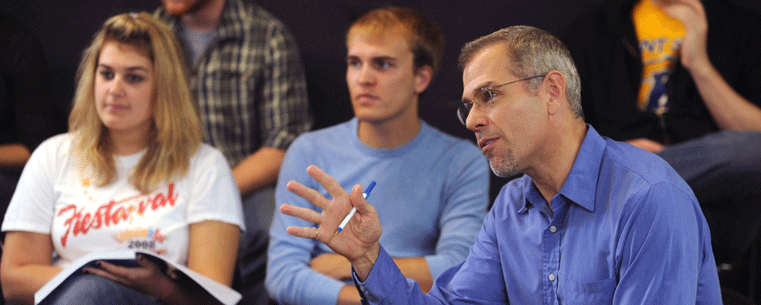 Kent State University Associate Professor Eric Van Baars offers advice to students in a performance class in the Roe Green Center for the School of Theatre and Dance. Kent State has been named one of the 2011 “Great Colleges to Work For.”