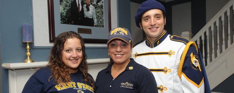 <p>A parent and her children, all Kent State alumni, pose for a photo in the Williamson Alumni Center. This year’s Parents’ and Family Day is Saturday, Sept. 24.</p>