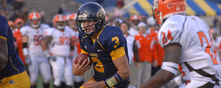 Golden Flashes quarterback Spencer Keith looks for an opening to run through during Kent State's victory over Bowling Green Saturday.