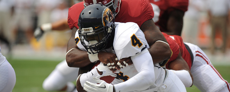 Eric Adeyemi, gains some yards against the Crimson Tide.