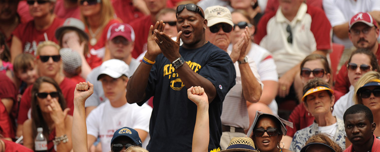 <p>A Kent State fan cheers on the Golden Flashes.</p>