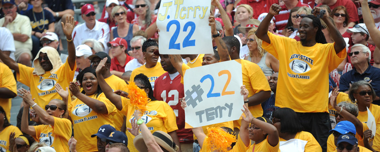 <p>Golden Flashes fans who made the trip to Tuscaloosa cheer on the team from the visiting section.</p>