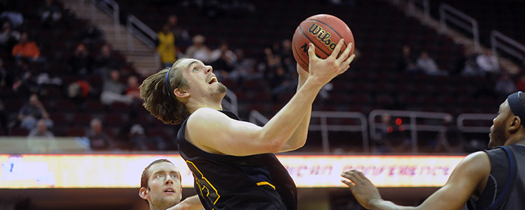 Kent State’s Mark Henniger rebounds during the first half of the Golden Flashes 70-68 win over Buffalo in the MAC Tournament.