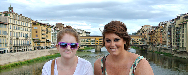 Kent State students Margaret Suren (left) and Kristen Durkin (right) pose for a picture on the Ponte Santa Trinita looking upon Ponte Vecchio in Florence, Italy. Durkin said her study abroad experience gave her the chance to grow as an individual and enhance her cultural awareness. (Photo provided by Kristen Durkin)