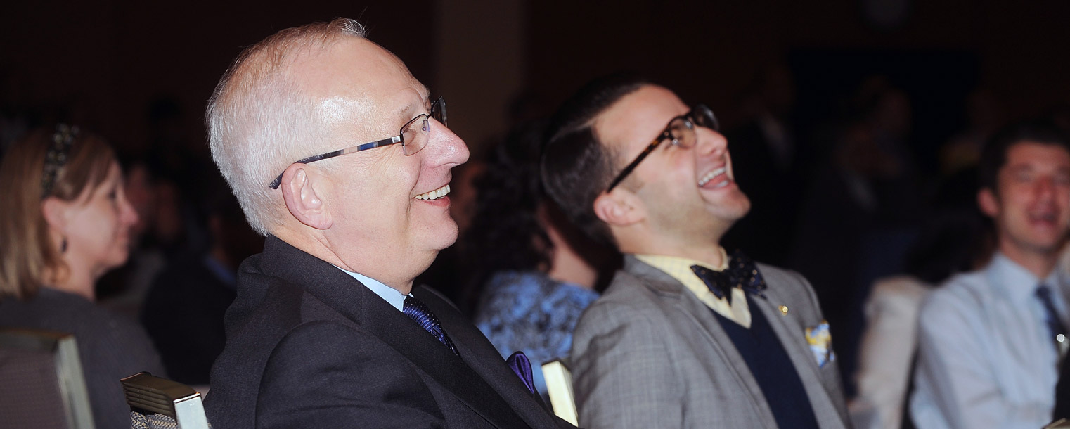 Kent State President Lester A. Lefton shares a laugh with the audience during the playing of a video created in his honor that was shown during the April 4 afternoon reception.