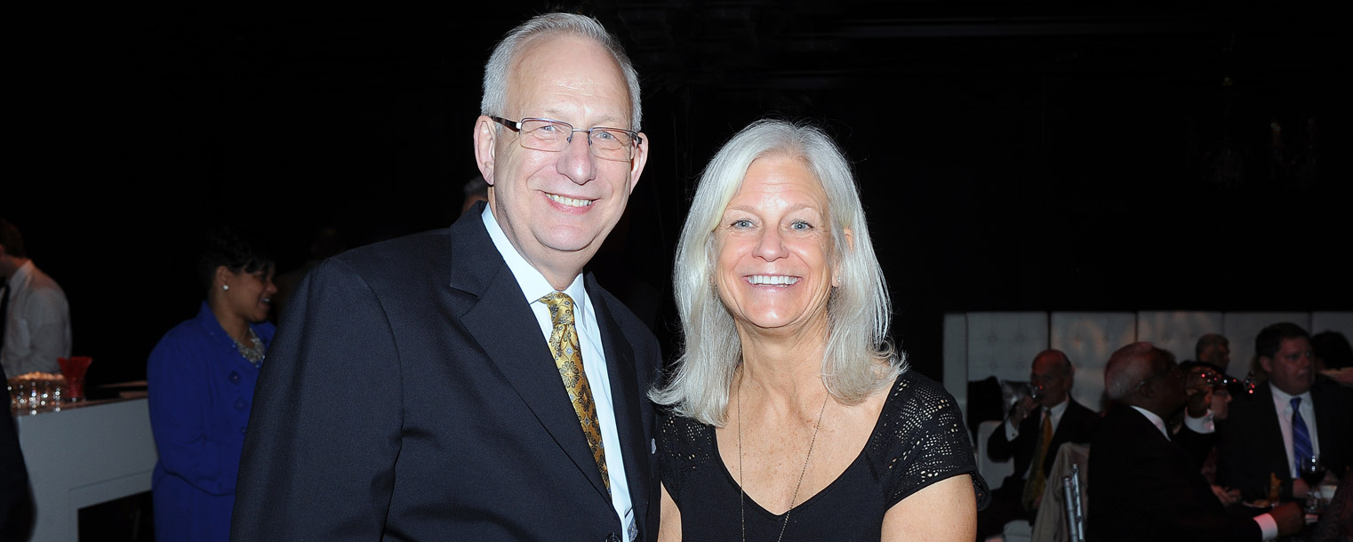 Kent State President Lester A. Lefton shares some of his recent photos on his iPhone with Anne Morrison, an associate professor in the School of Lifespan Development and Educational Sciences, during the Celebration of Leadership event.