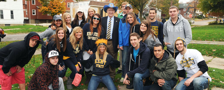 Kent State President Lester A. Lefton celebrates Homecoming with members of the Kent State Greek community.