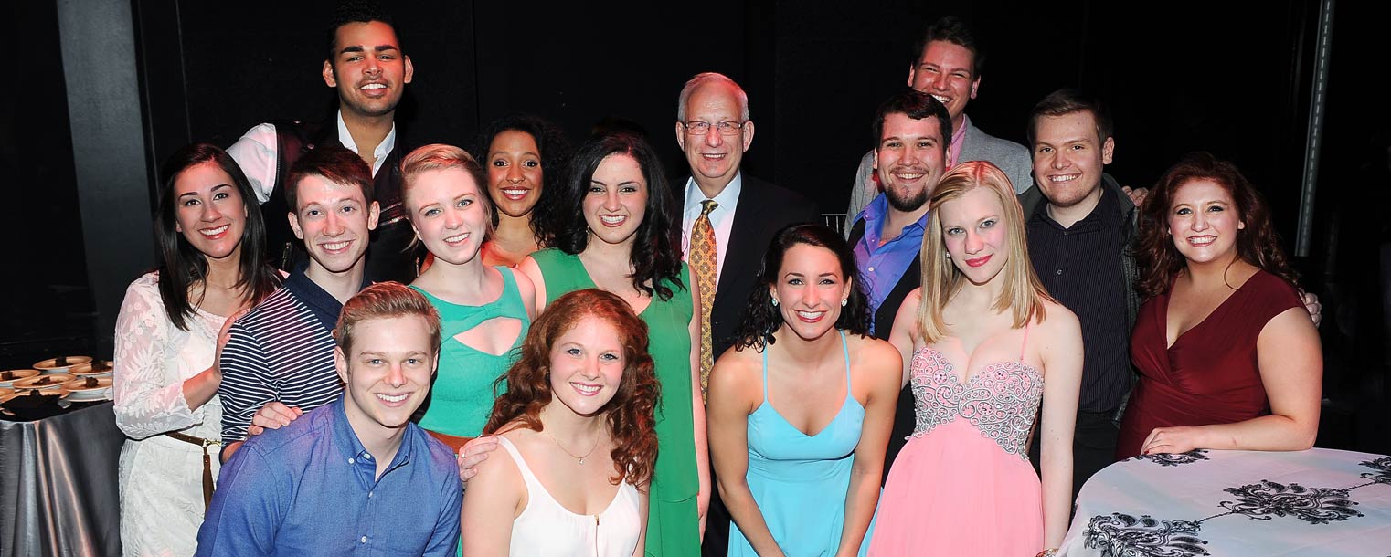 Kent State President Lester A. Lefton poses with students who performed in the Senior Showcase at the April 4 evening reception in the Black Box Theatre.