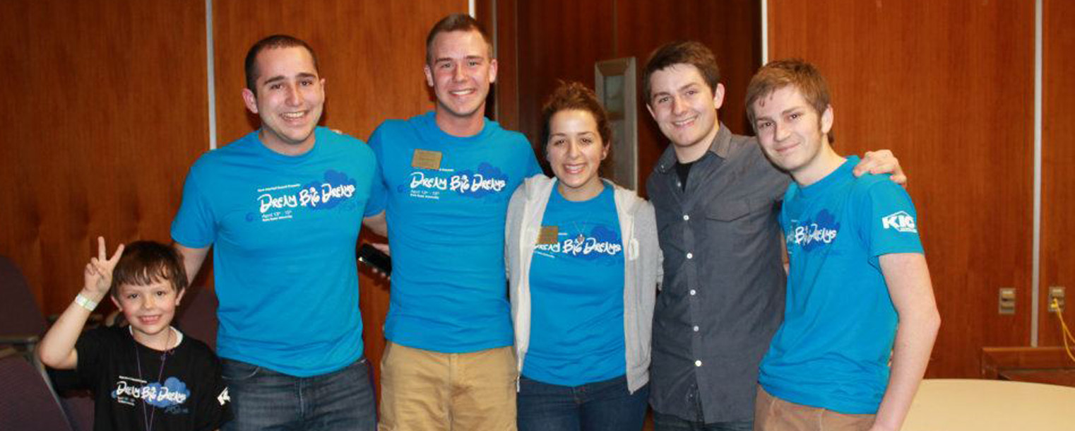 Members of Kent Interhall Council, hosts of Lil’ Sibs Weekend, pose for a photo with a little sibling.