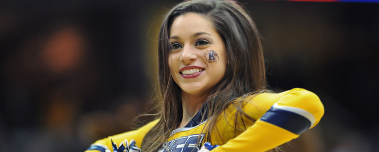 A member of the Kent State dance team celebrates following Kent State's 76-72 win over Western Michigan during the quarterfinal match up of the 2012 Mid-American Conference Tournament in Cleveland.