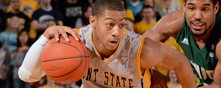 Kent State guard Kellon Thomas moves past an Ohio University defender during a 2013 game in the Memorial Athletic and Convocation Center.