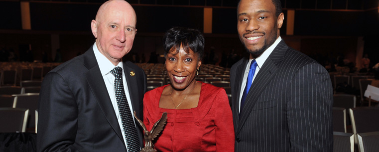 <p>Dr. David Mohan, dean and CEO of Kent State University at Geauga, receives the 2012 Diversity Trailblazer Award from Dr. Alfreda Brown, Kent State vice president for Diversity, Equity and Inclusion, and keynote speaker Dr. Marc Lamont Hill during the university’s 10th annual Martin Luther King Jr. Celebration in the Kent Student Center Ballroom.</p>