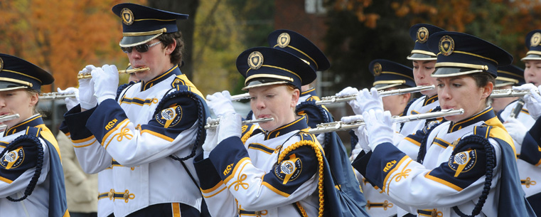 <p>The Kent State University Marching Band makes its way down Main Street, during the annual Homecoming parade.</p>