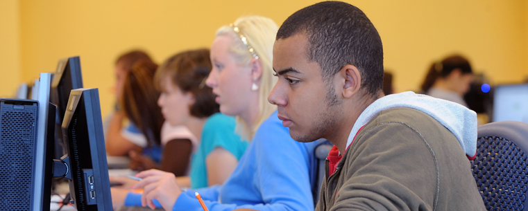 <p>Kent State students focus on work at their own individualized pace in the new Math Emporium, located on the second floor of the University Library.</p>