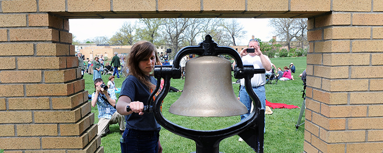 A member of the May 4 Task Force rings the bell at the moment of the May 4, 1970, shootings - 43 years earlier - during the annual commemoration.