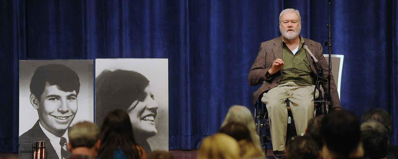 Dean Kahler, a student wounded during the May 4, 1970, shootings on the campus of Kent State University, speaks to those attending the 44th commemoration ceremonies in the Ballroom of the Kent Student Center.