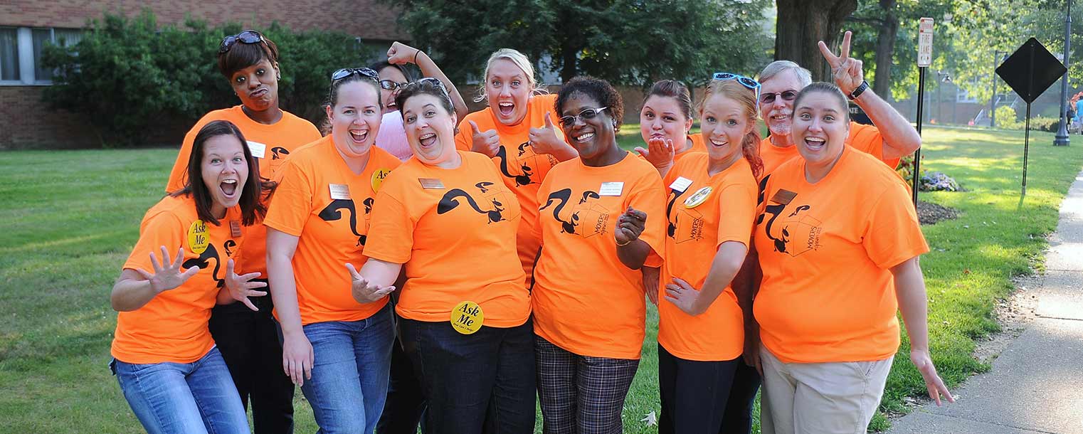 Employees from the Center for Student Involvement display a fun and welcoming spirit on their way to volunteer for Movers and Groovers, helping new students move into the residents halls.