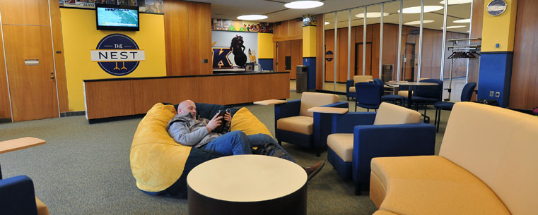 A student relaxes in the renovated Nest, on the second floor of the Student Center.