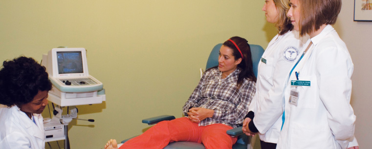 Students studying podiatry observe an examination of a patient’s foot. (Photo courtesy of the Ohio College of Podiatric Medicine)